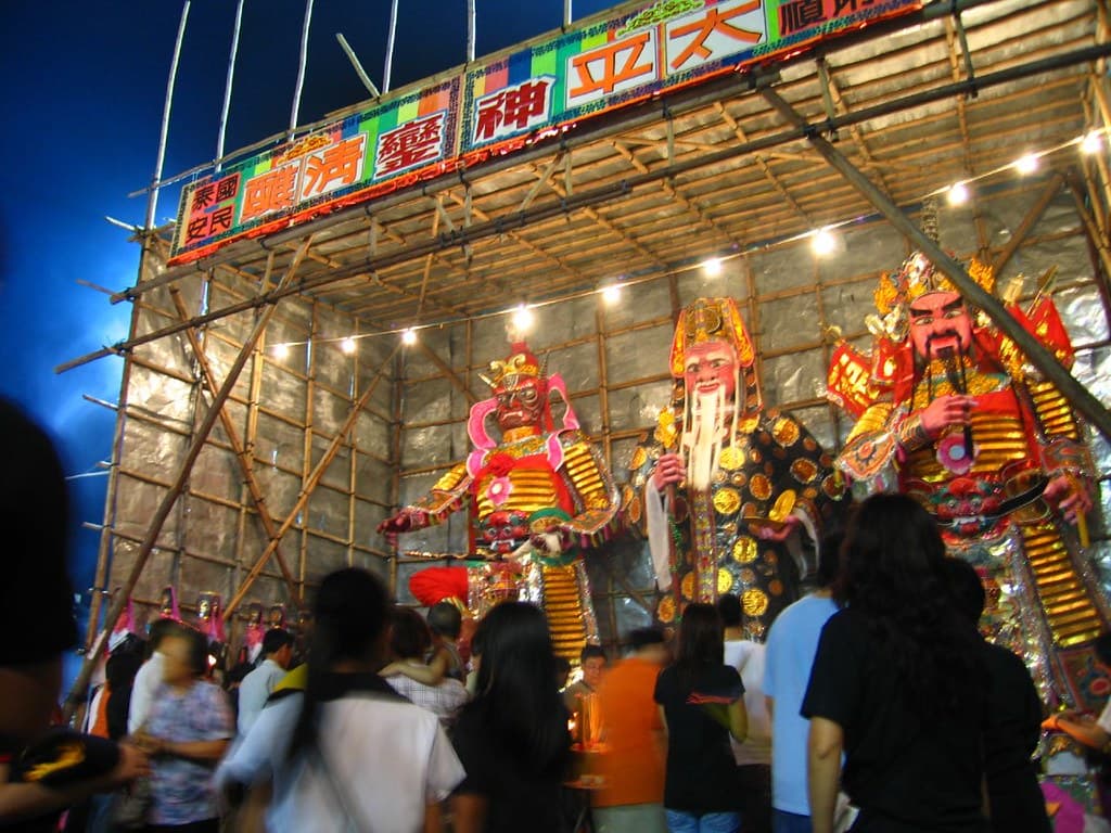 Lit-up stage and decorated shrine crowds during the Da Jiu festival on Cheung Chau