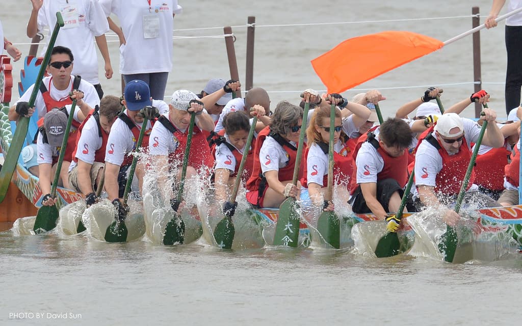 Teams paddling hard in a dragon boat race
