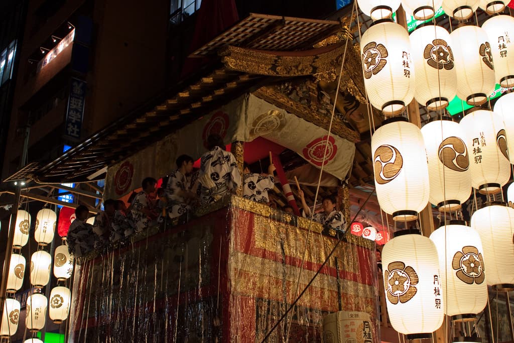 Rows of paper lanterns glowing on a Yamaboko float during the Yoiyama nights of Gion Matsuri in Kyoto