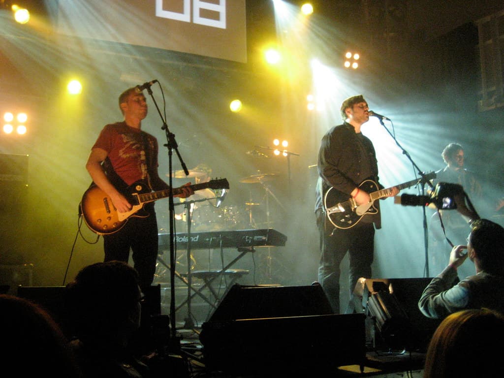 The band Dikta performing under stage lights at Iceland Airwaves