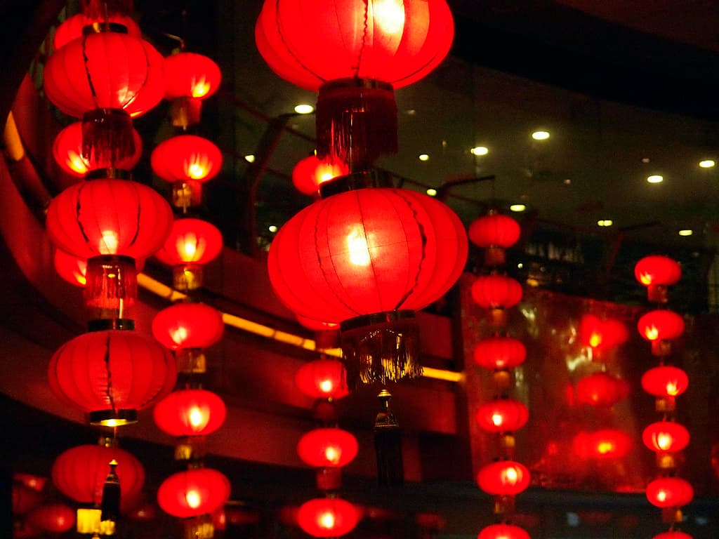 Rows of glowing red paper lanterns hanging for the Lantern Festival