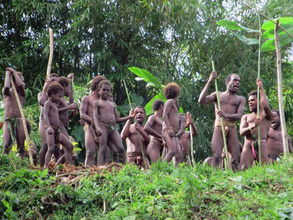 Villagers with spears gathered in the forest on Pentecost Island, Vanuatu