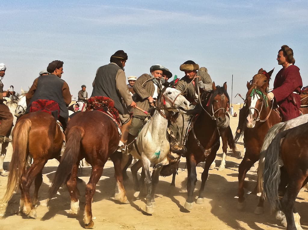 Riders competing in a buzkashi match during Nowruz celebrations in Mazar-i-Sharif