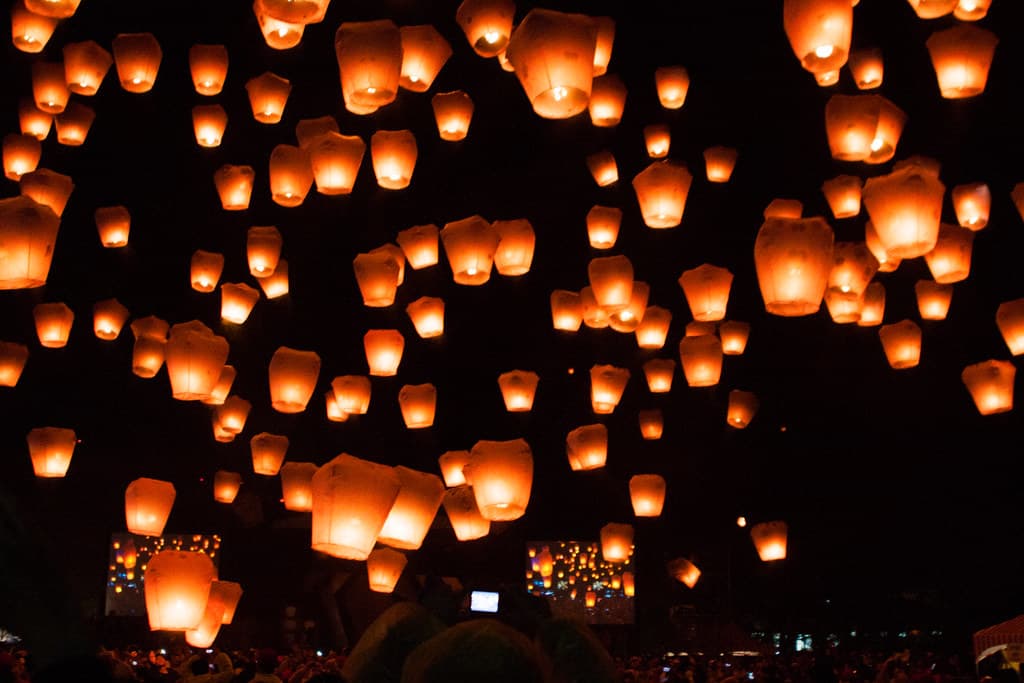 Hundreds of glowing paper sky lanterns rise into the night sky over Pingxi during the Sky Lantern Festival in Taiwan