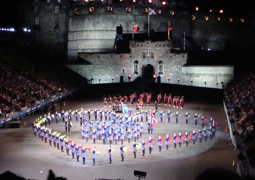 Massed military bands form a ring on the floodlit esplanade in front of Edinburgh Castle, watched by packed grandstands