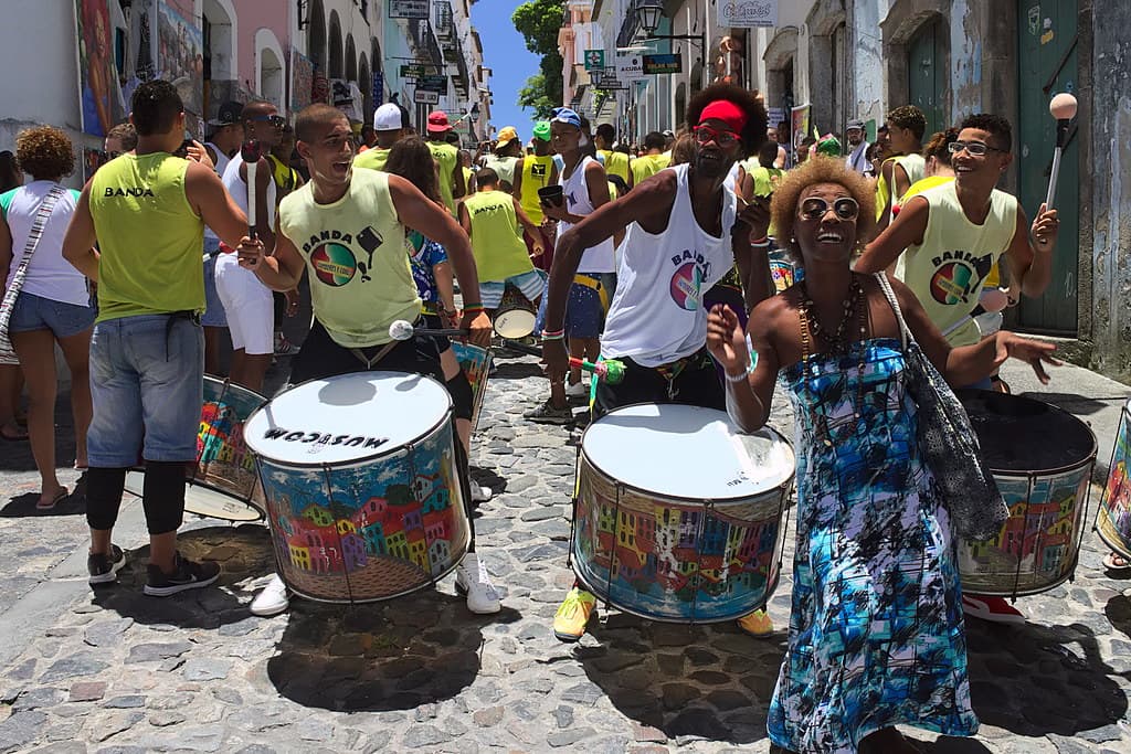 Drummers and dancers filling a Salvador street during Carnival