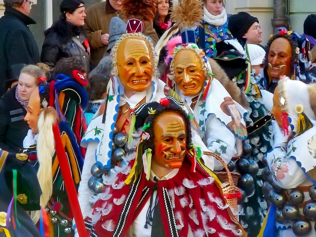 Masked Fasnet fools in carved wooden masks, bells and colourful costumes crowd the street during the Rottweil Narrensprung
