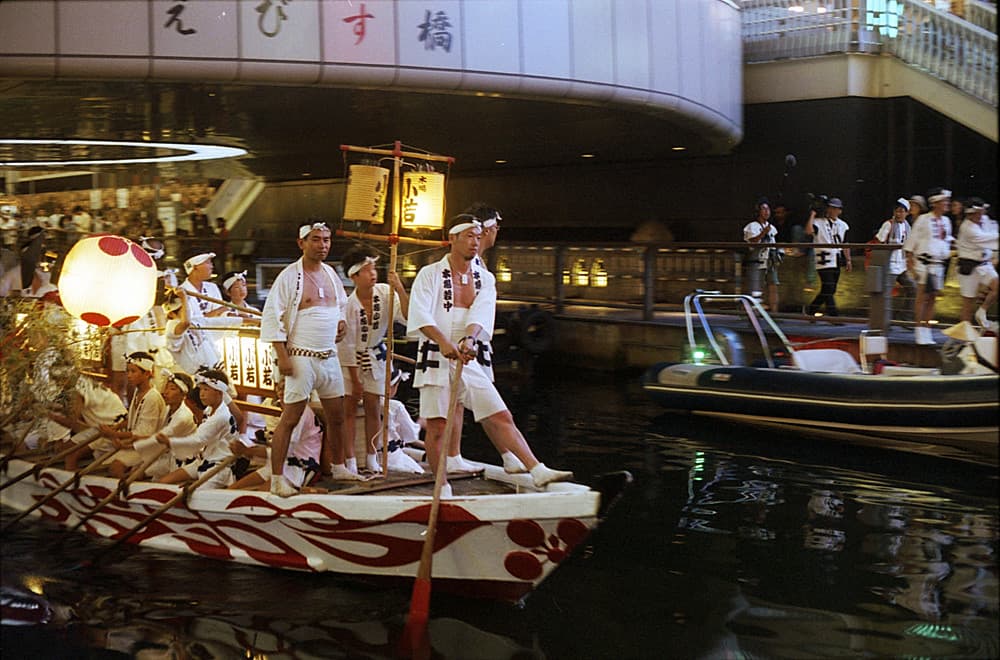 Festival boats on the river during the Tenjin Matsuri in Osaka