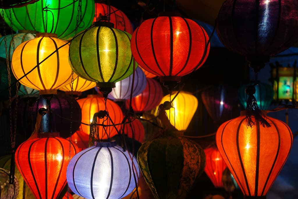 Colorful silk lanterns glowing in Hoi An