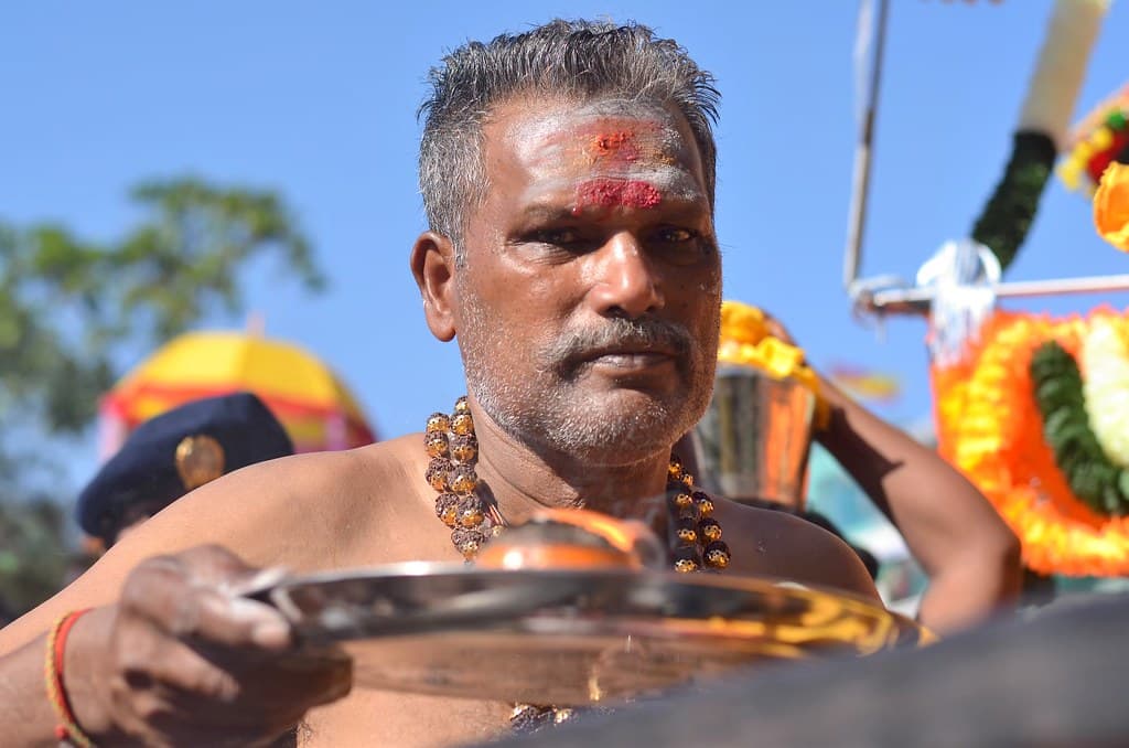 A Thaipusam devotee holding an offering tray, portrait