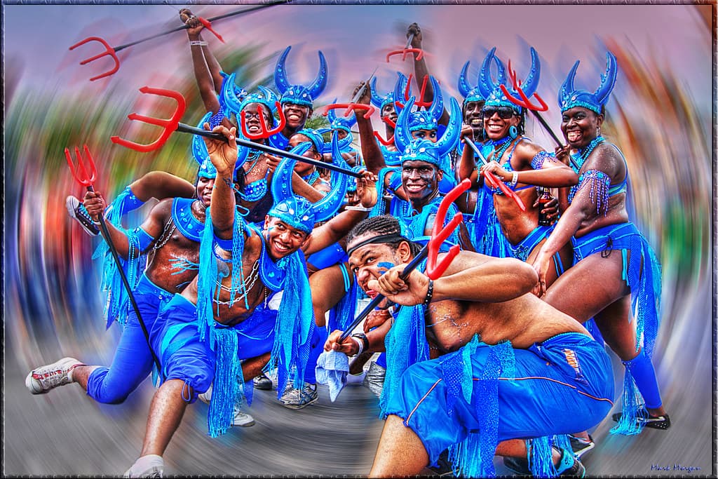 A troupe of blue devil dancers in motion at Trinidad Carnival