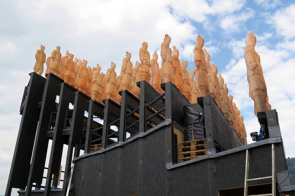 Rows of warrior statues stand on the floating stage set on Lake Constance in Bregenz
