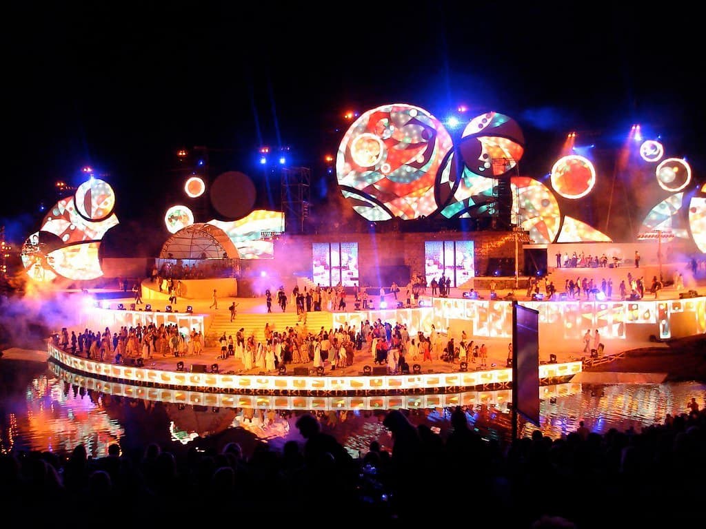 The illuminated stage of the Teatro Griego glows with lights and set pieces during the Vendimia show in Mendoza at night
