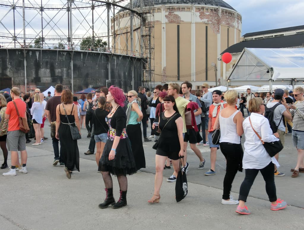 Crowds walk past food stalls and tents at Flow Festival in Helsinki