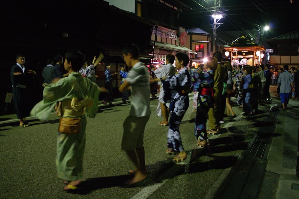 Dancers in yukata fill a lantern-lit street in Gujo Hachiman during the all-night dance