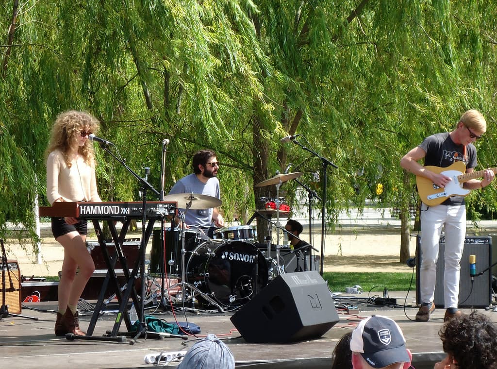 A band plays an outdoor afternoon set by the trees at Primavera Sound in Barcelona